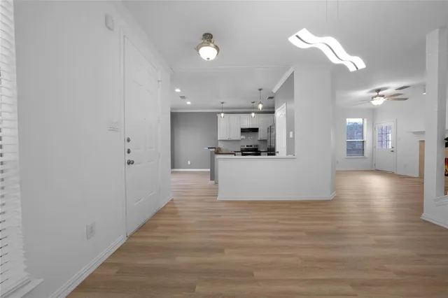 a view of kitchen and kitchen with a sink