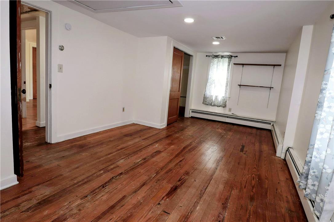 172 Harrison Street Emmaus, PA 18049 - Photo 16 of 30 Sun-filled room featuring polished hardwood flooring and recessed ceiling lighting.
