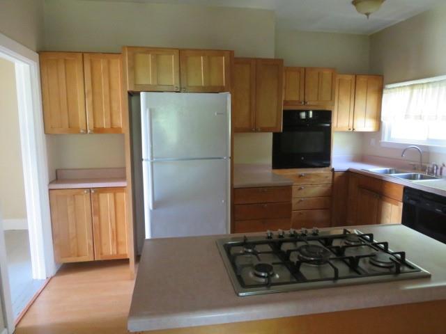 481 Cecil-Henderson Road Cecil, PA 15321 - Photo 12 of 33 a kitchen with wooden cabinets and a stove