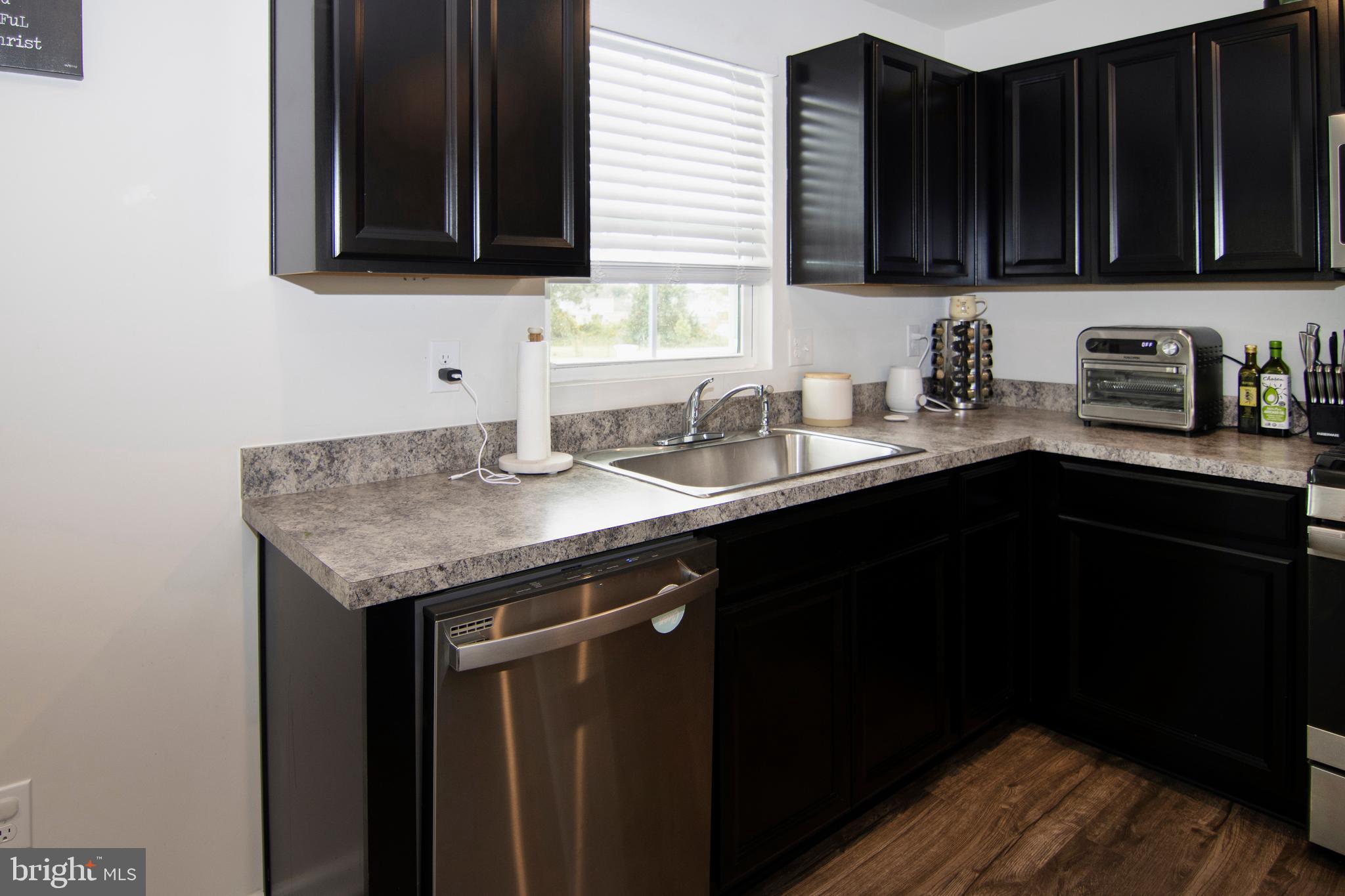 32 Burr Street Williamstown, NJ 08094 - Photo 11 of 34 a kitchen with a sink and a cabinets