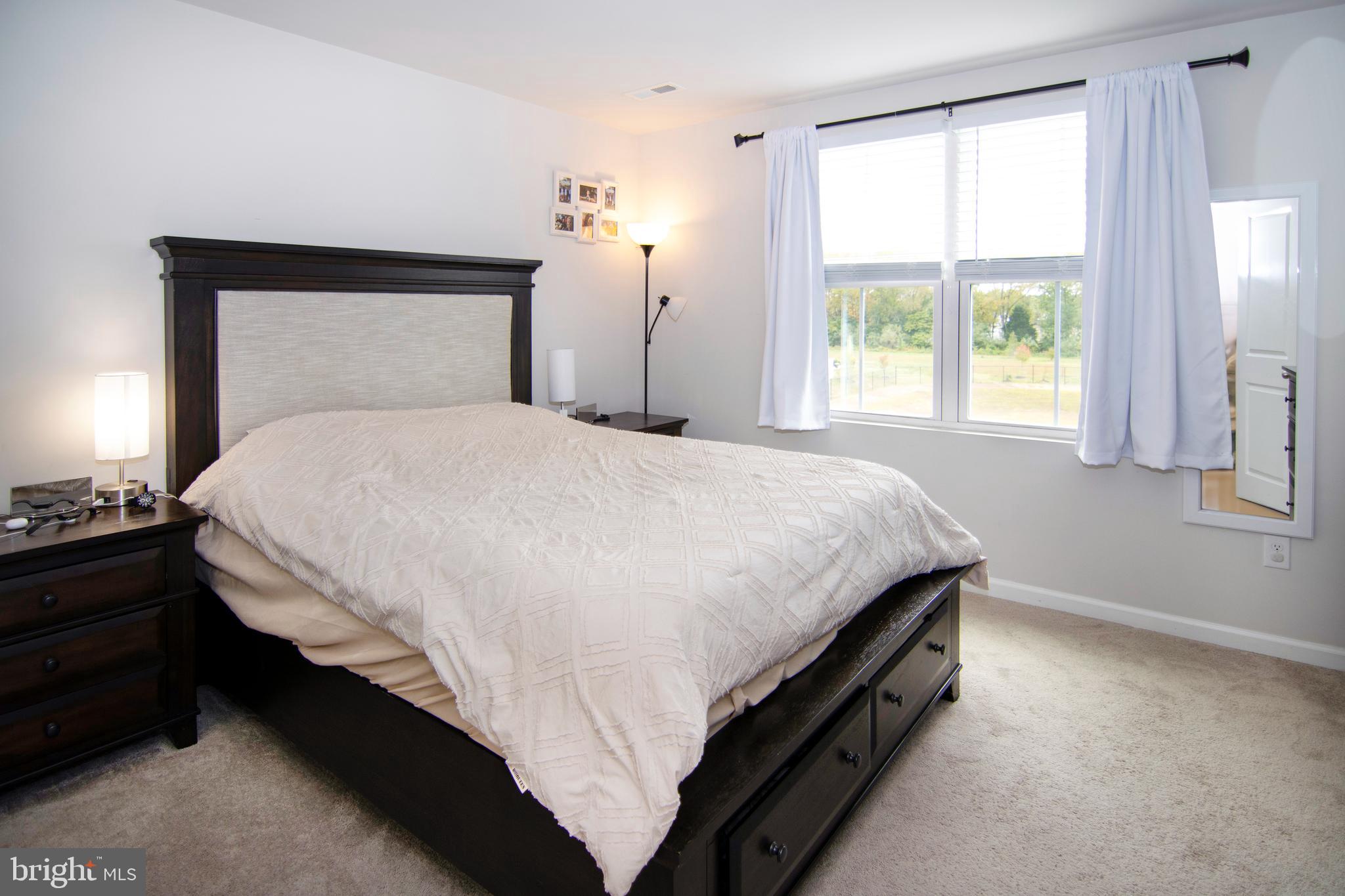 32 Burr Street Williamstown, NJ 08094 - Photo 16 of 34 a bedroom with a bed and a window