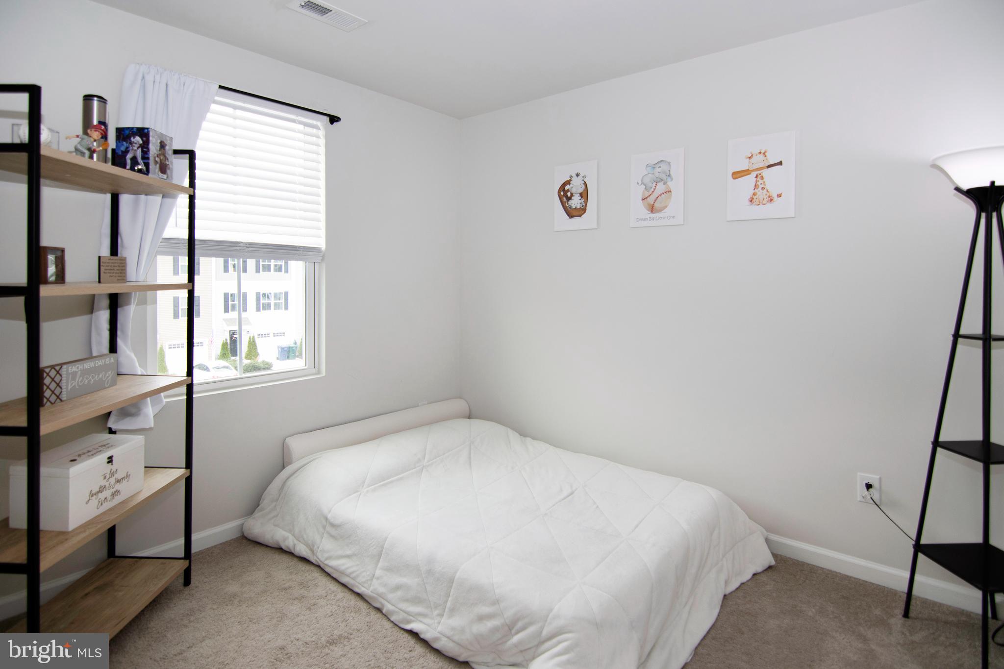 32 Burr Street Williamstown, NJ 08094 - Photo 21 of 34 a bedroom with a bed and a window