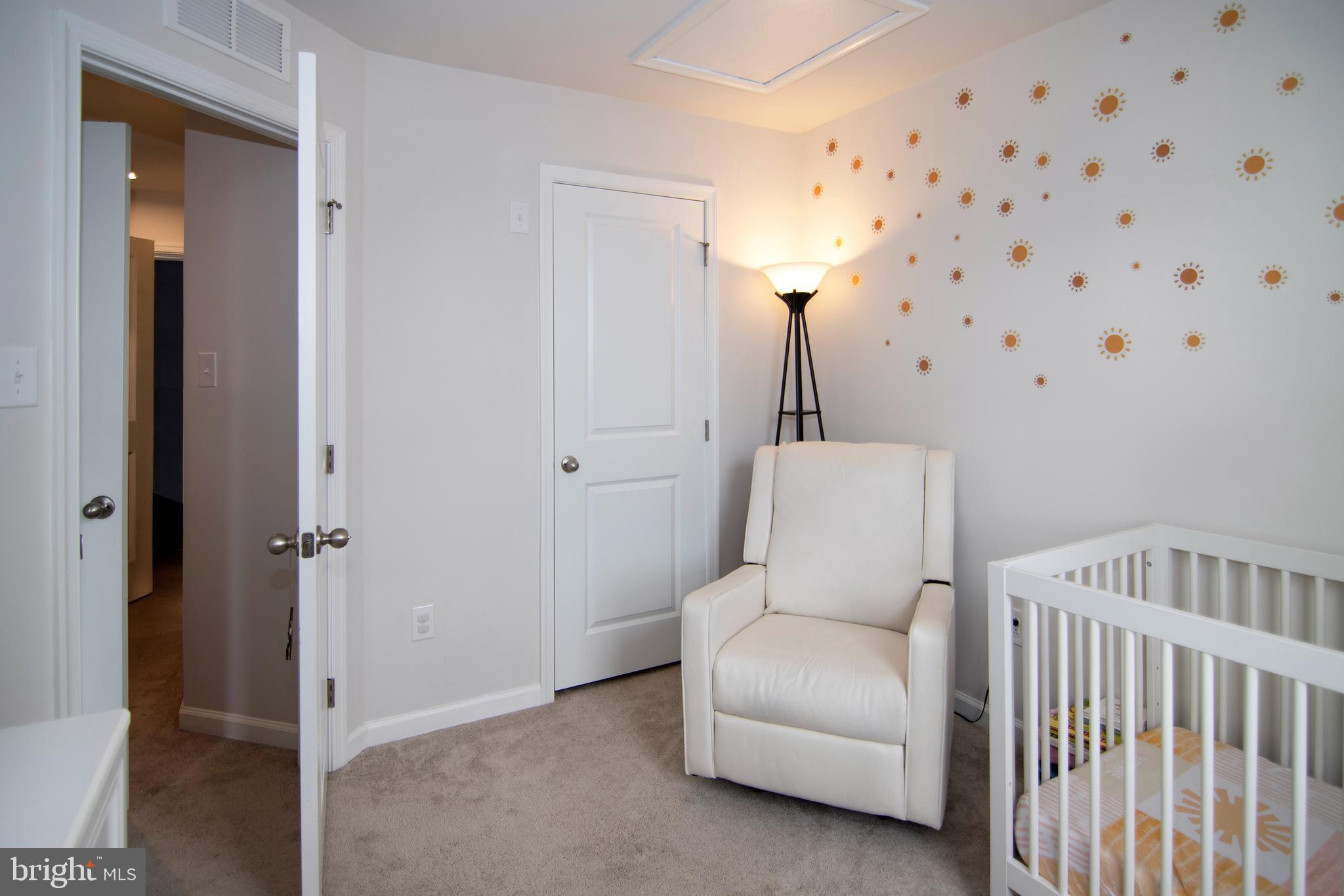 32 Burr Street Williamstown, NJ 08094 - Photo 26 of 34 a hallway with a couch and a chandelier
