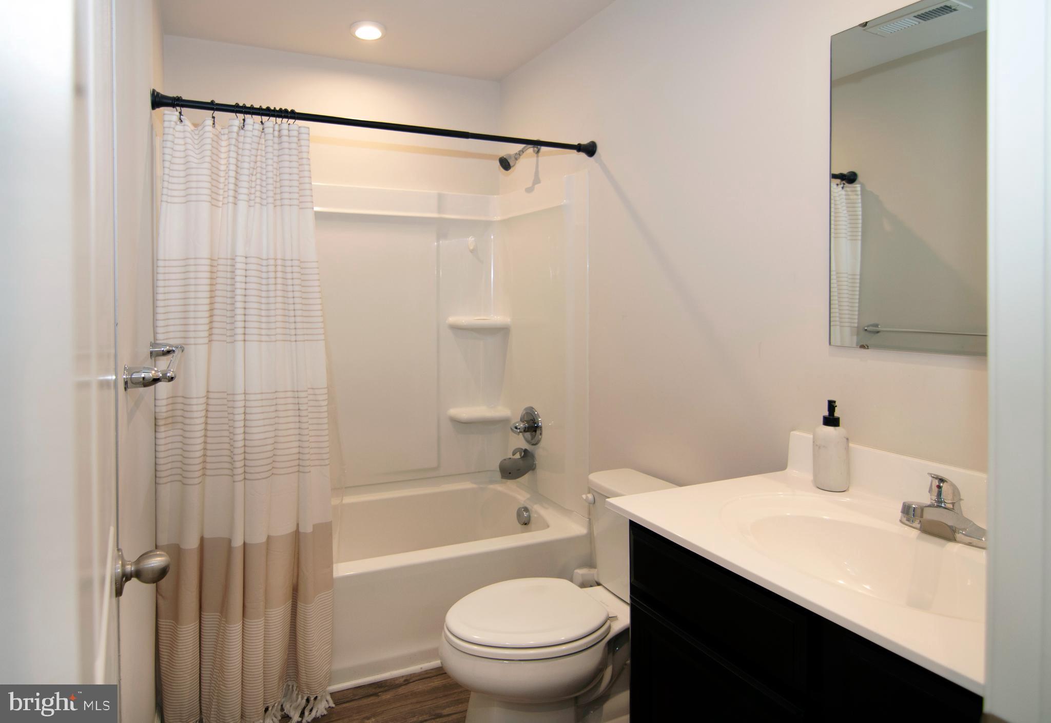 32 Burr Street Williamstown, NJ 08094 - Photo 27 of 34 a bathroom with a sink a toilet and shower