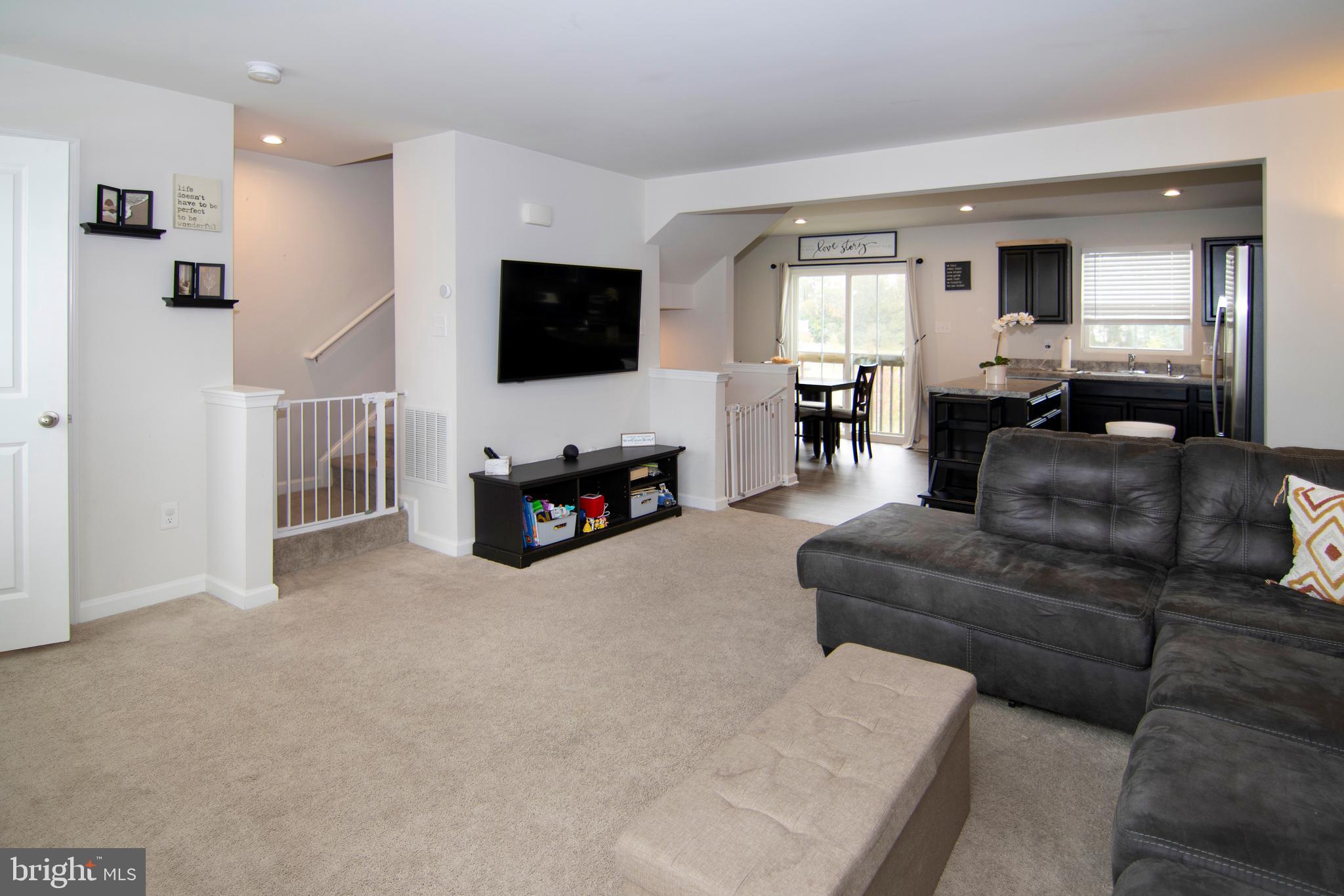 32 Burr Street Williamstown, NJ 08094 - Photo 6 of 34 a living room with furniture and a flat screen tv