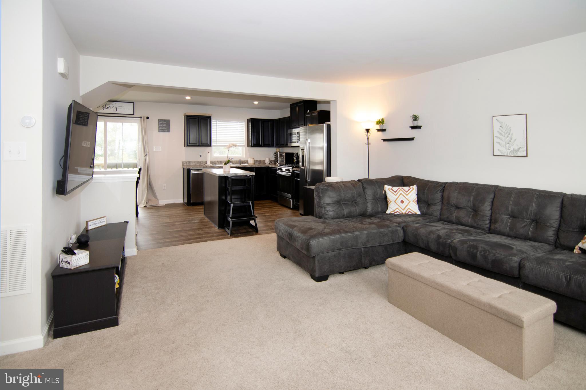32 Burr Street Williamstown, NJ 08094 - Photo 7 of 34 a living room with furniture and a flat screen tv