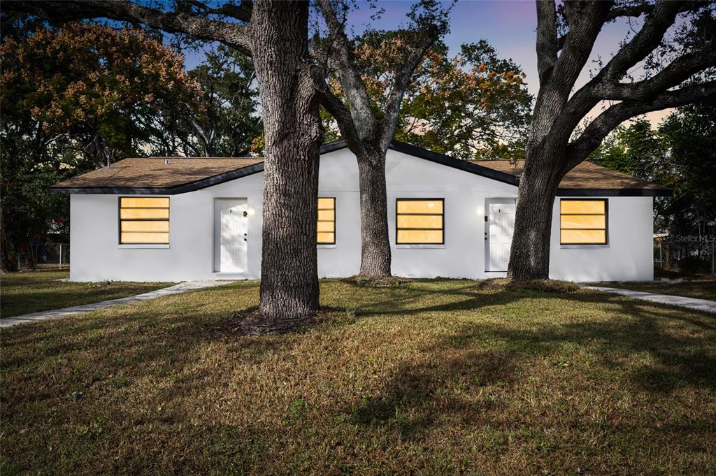 a view of a house with a yard