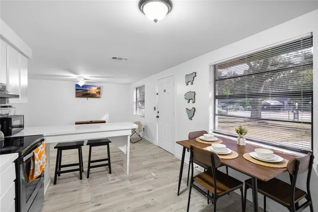 a view of a dining room with furniture