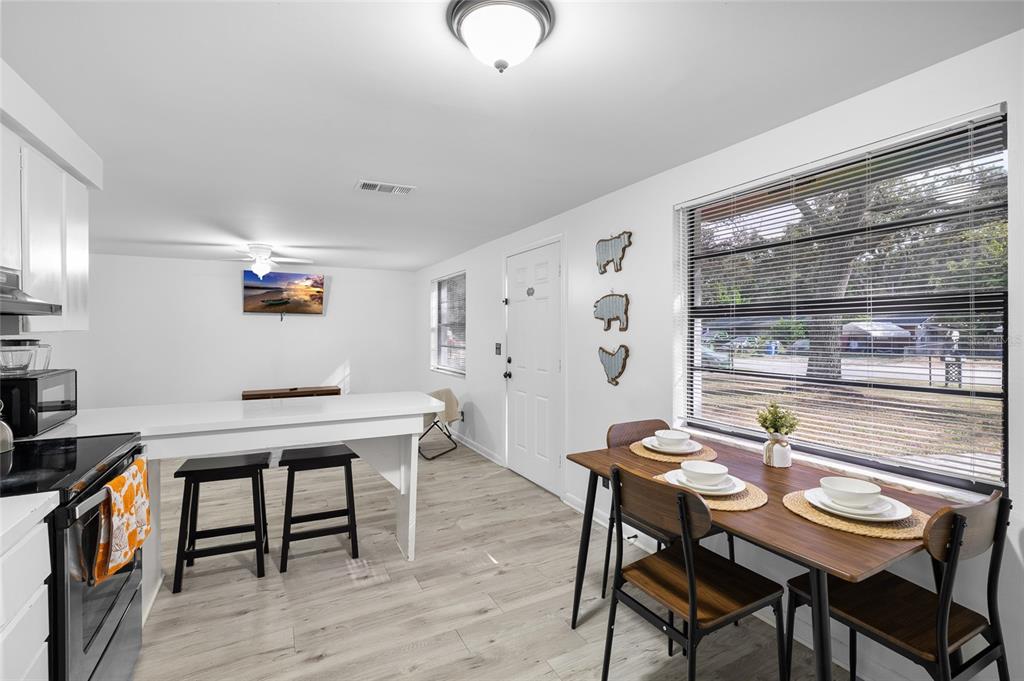 1220 East 142nd Avenue Tampa, FL 33613 - Photo 13 of 36 a view of a dining room with furniture