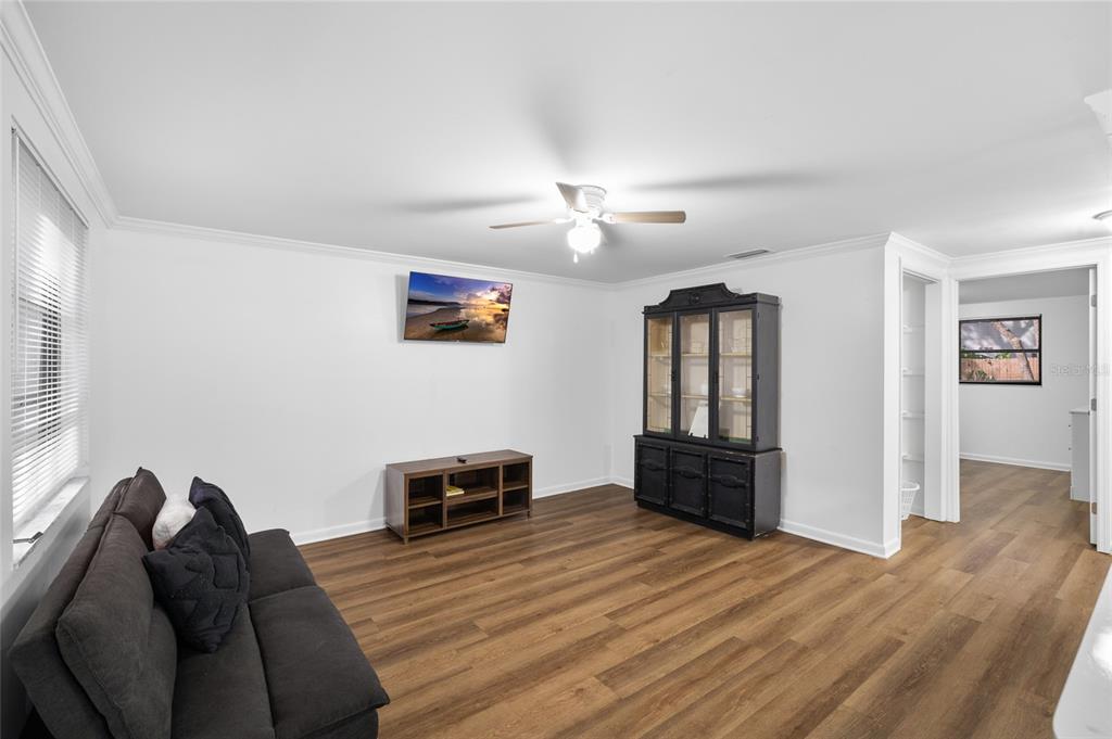 1220 East 142nd Avenue Tampa, FL 33613 - Photo 18 of 36 a bedroom with furniture and wooden floor