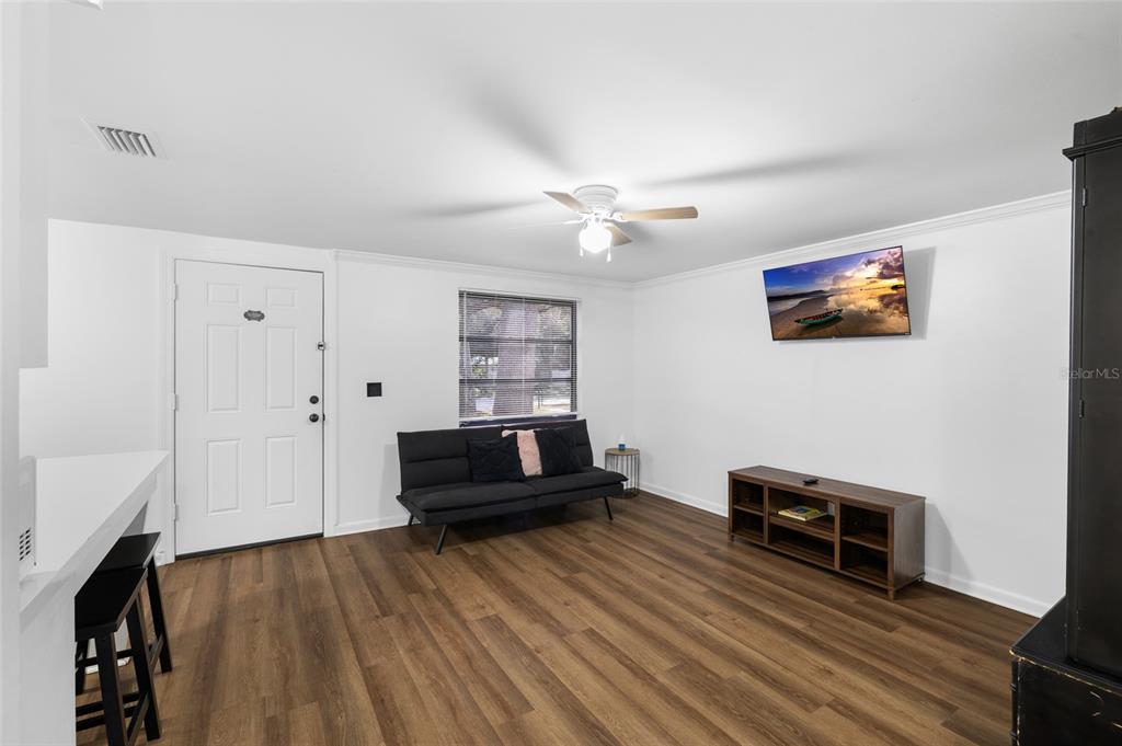 1220 East 142nd Avenue Tampa, FL 33613 - Photo 19 of 36 a living room with furniture and a flat screen tv