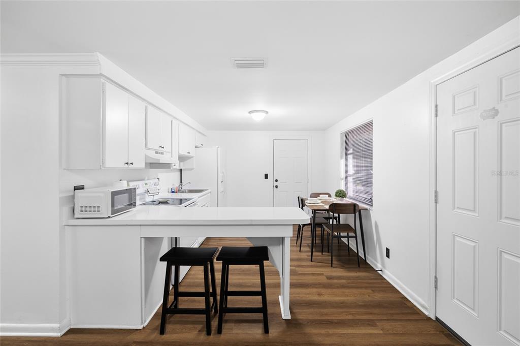 1220 East 142nd Avenue Tampa, FL 33613 - Photo 22 of 36 a view of a dining room with furniture