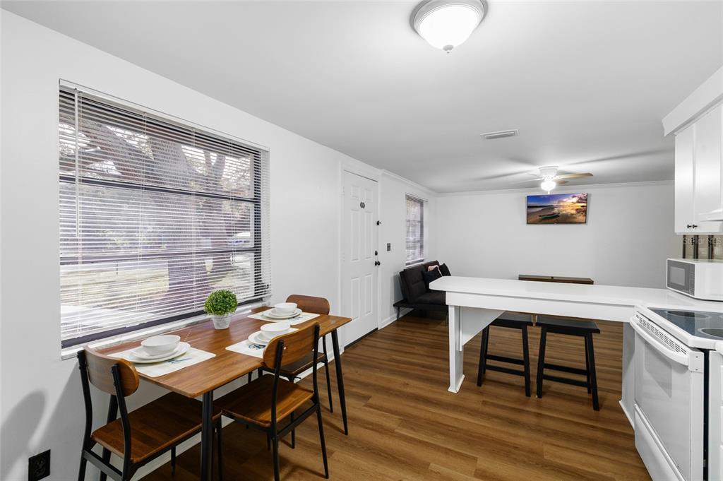 1220 East 142nd Avenue Tampa, FL 33613 - Photo 24 of 36 a view of a workspace with furniture and a table in it