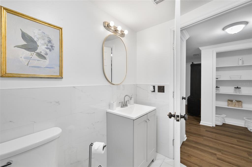 1220 East 142nd Avenue Tampa, FL 33613 - Photo 32 of 36 a bathroom with a sink and a mirror