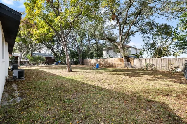 a view of house with outdoor space and garden