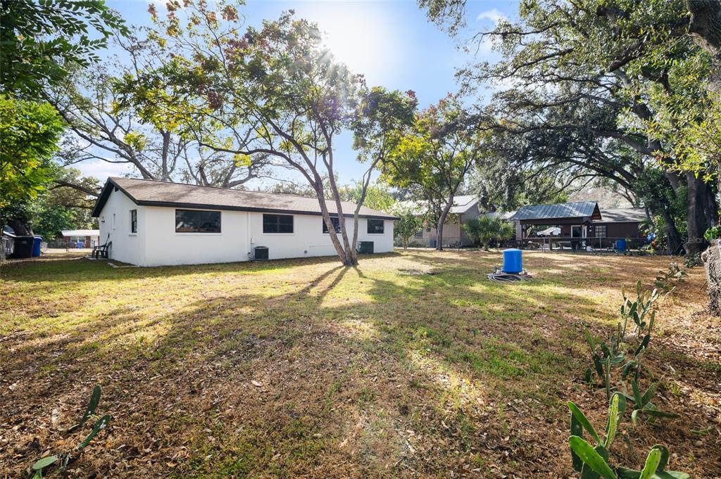 1220 East 142nd Avenue Tampa, FL 33613 - Photo 34 of 36 a view of house with outdoor space and garden