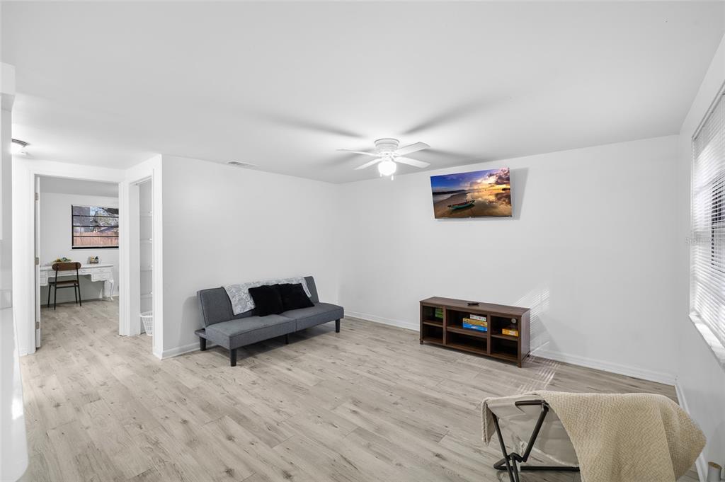 1220 East 142nd Avenue Tampa, FL 33613 - Photo 7 of 36 a living room with furniture and a flat screen tv