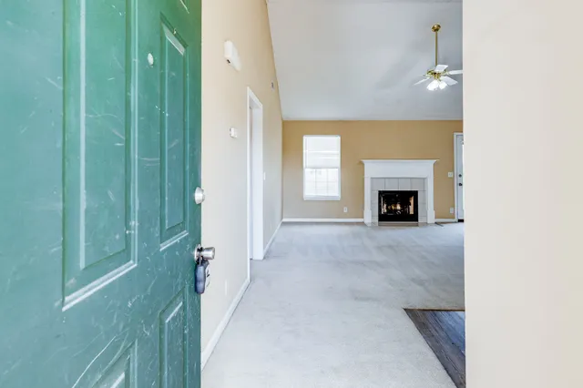 a view of livingroom with washer and dryer