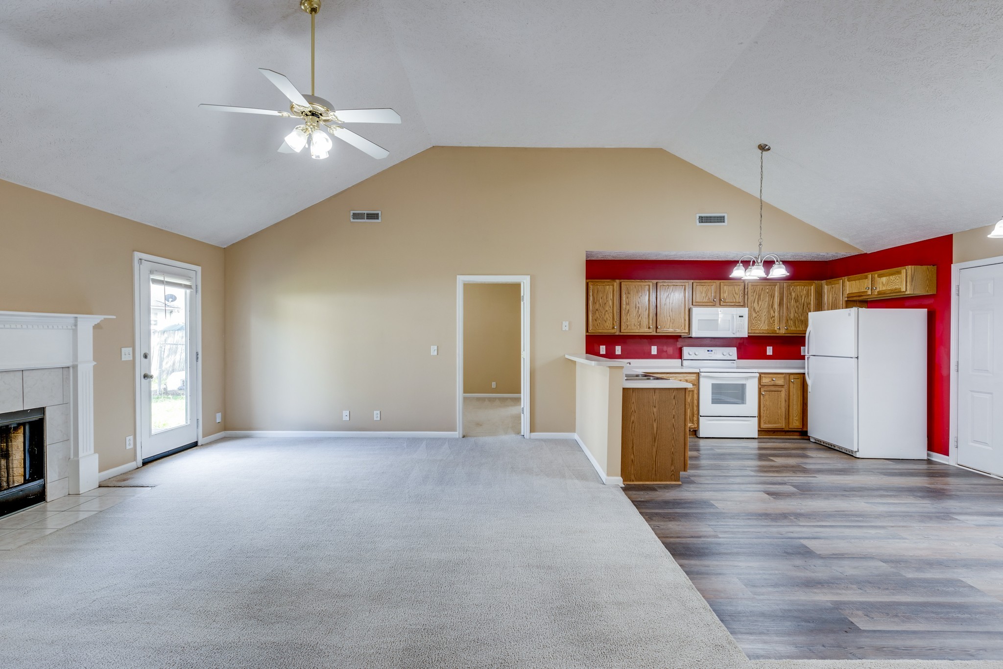 1418 Owasa Trail Murfreesboro, TN 37130 - Photo 19 of 23 a view of a kitchen with a stove cabinets and a floor to ceiling window