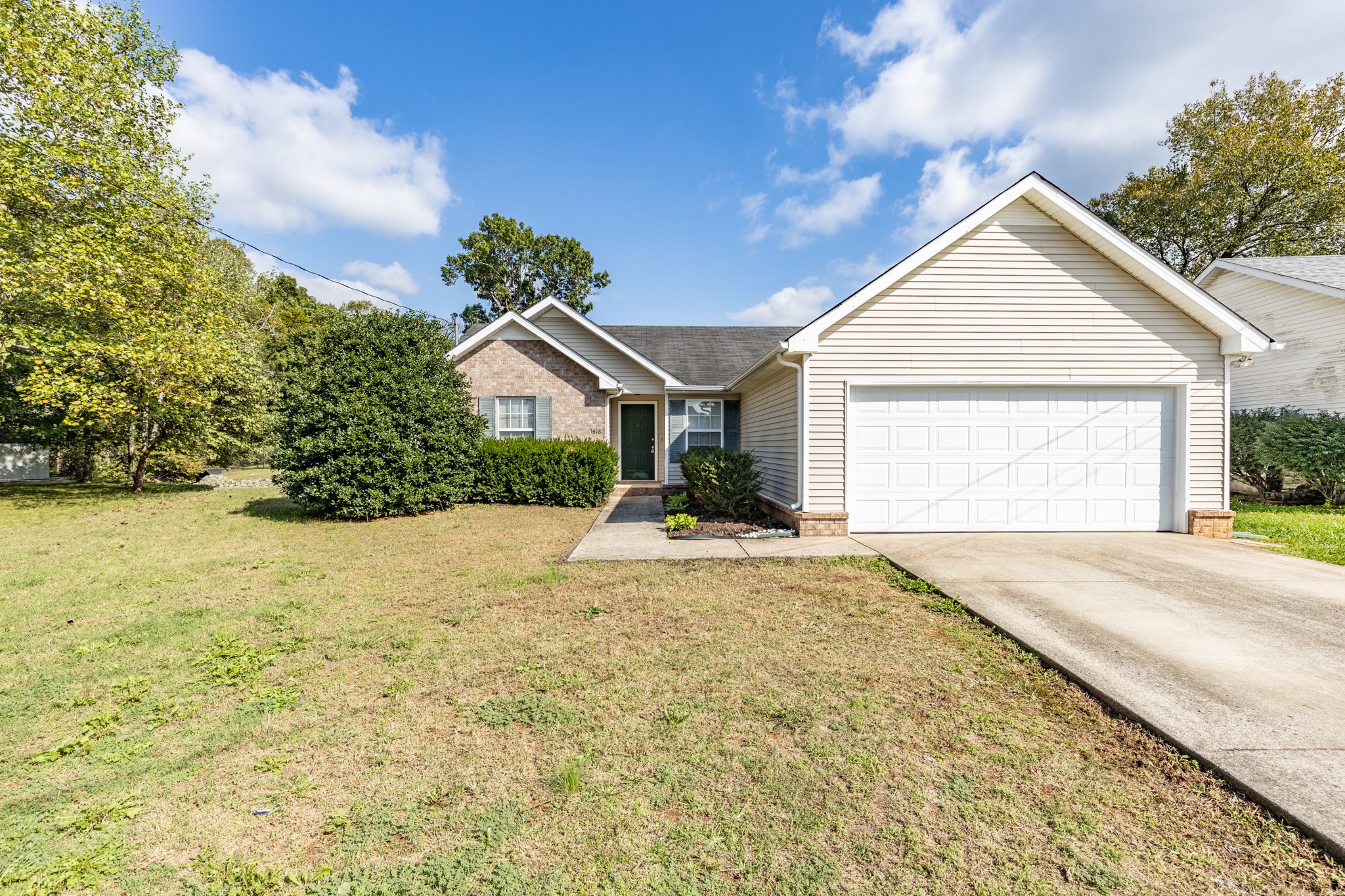1418 Owasa Trail Murfreesboro, TN 37130 - Photo 2 of 23 a view of a house with a yard and garage