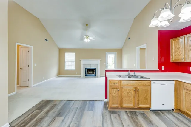 a view of a room with wooden floor and cabinet