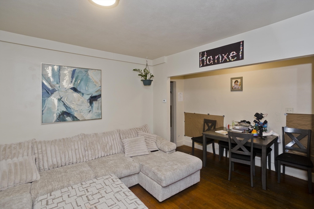298 Oakland Street Springfield, MA 01108 - Photo 13 of 38 a living room with furniture and wooden floor