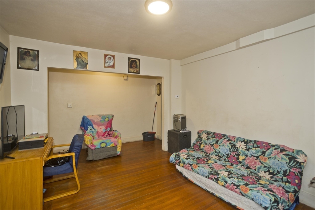 298 Oakland Street Springfield, MA 01108 - Photo 22 of 38 a living room with furniture and a couch