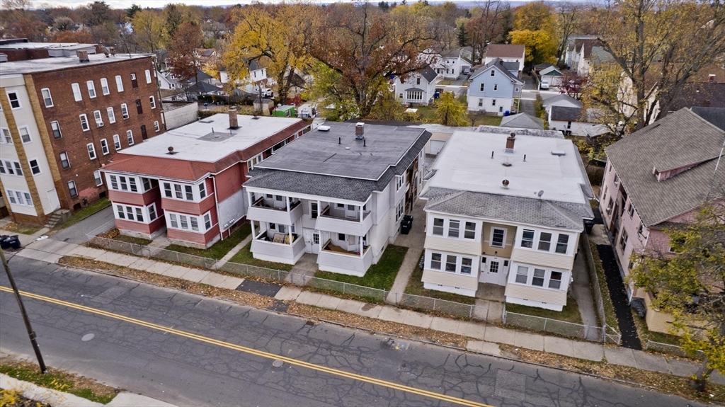 298 Oakland Street Springfield, MA 01108 - Photo 37 of 38 an aerial view of multi story residential apartment building with a yard
