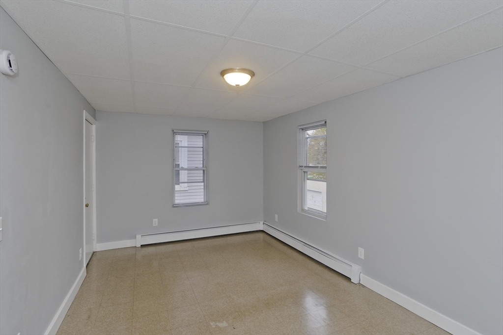 298 Oakland Street Springfield, MA 01108 - Photo 10 of 38 an empty room with windows