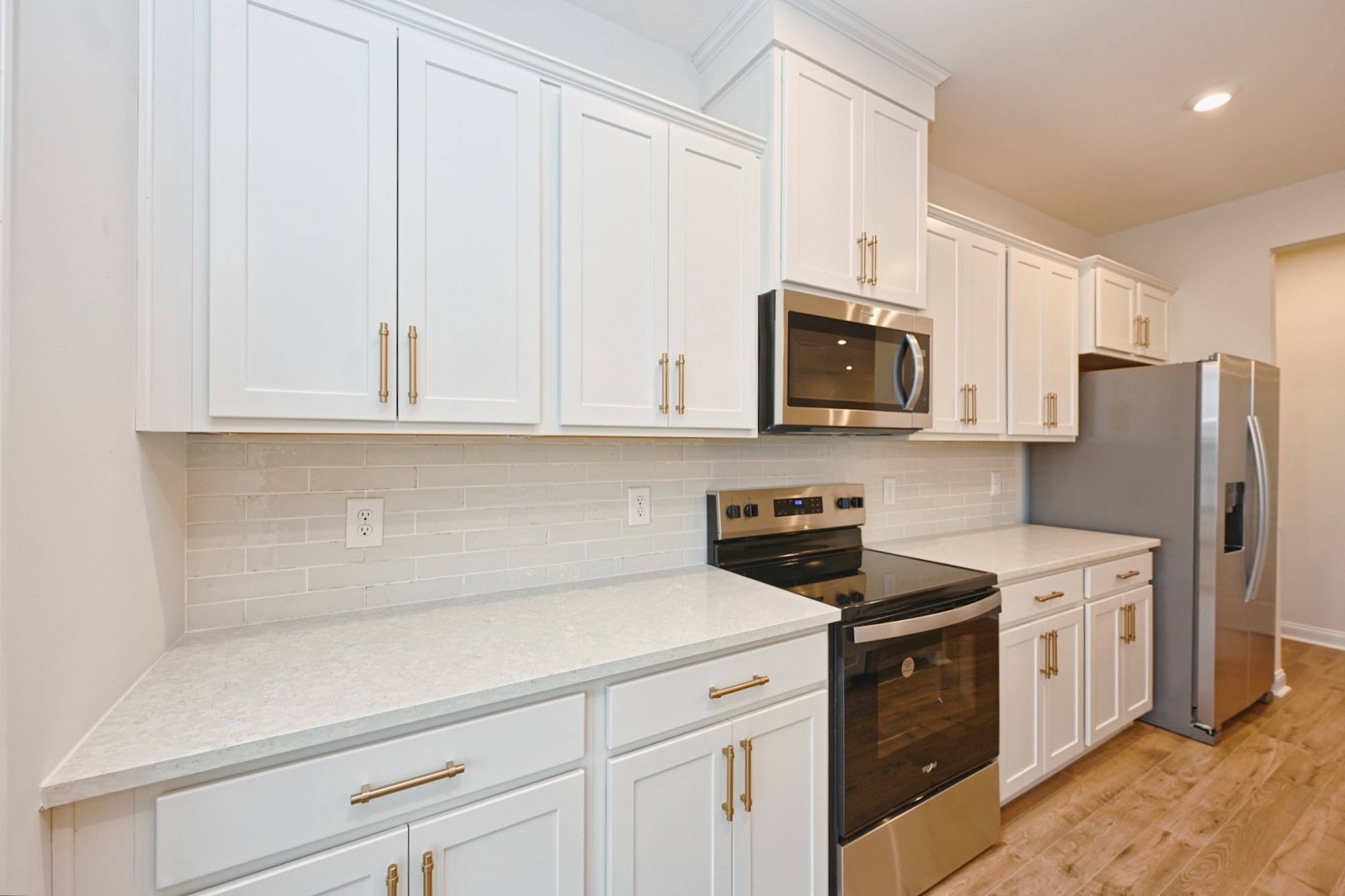 2305 Juneau Lane Columbia, TN 38401 - Photo 17 of 50 a kitchen with stainless steel appliances granite countertop white cabinets a stove a sink and dishwasher