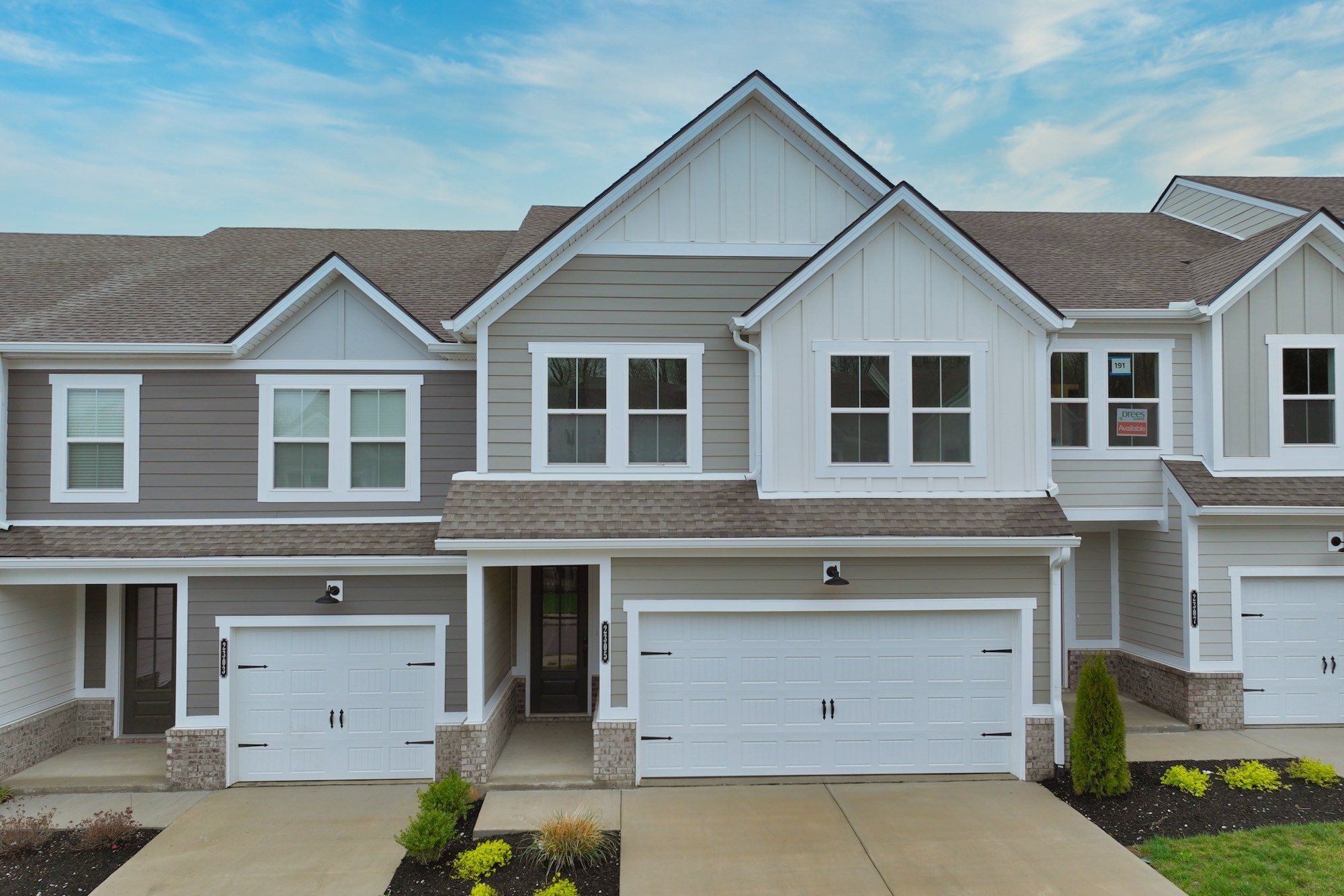 2305 Juneau Lane Columbia, TN 38401 - Photo 3 of 50 a front view of a house with a garage and outdoor seating