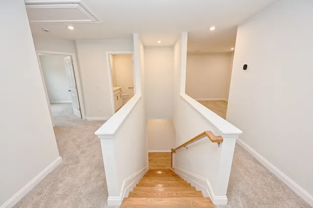 a view of a hallway with staircase