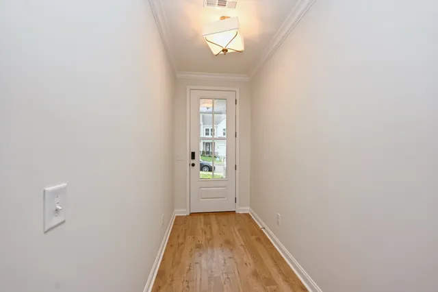a view of a hallway with a window