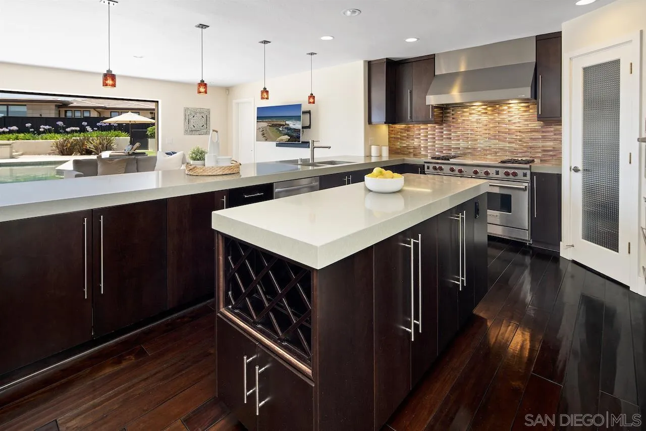 5510 Moonlight Lane La Jolla, CA 92037 - Photo 11 of 35 a kitchen with stainless steel appliances granite countertop a sink a stove and a refrigerator