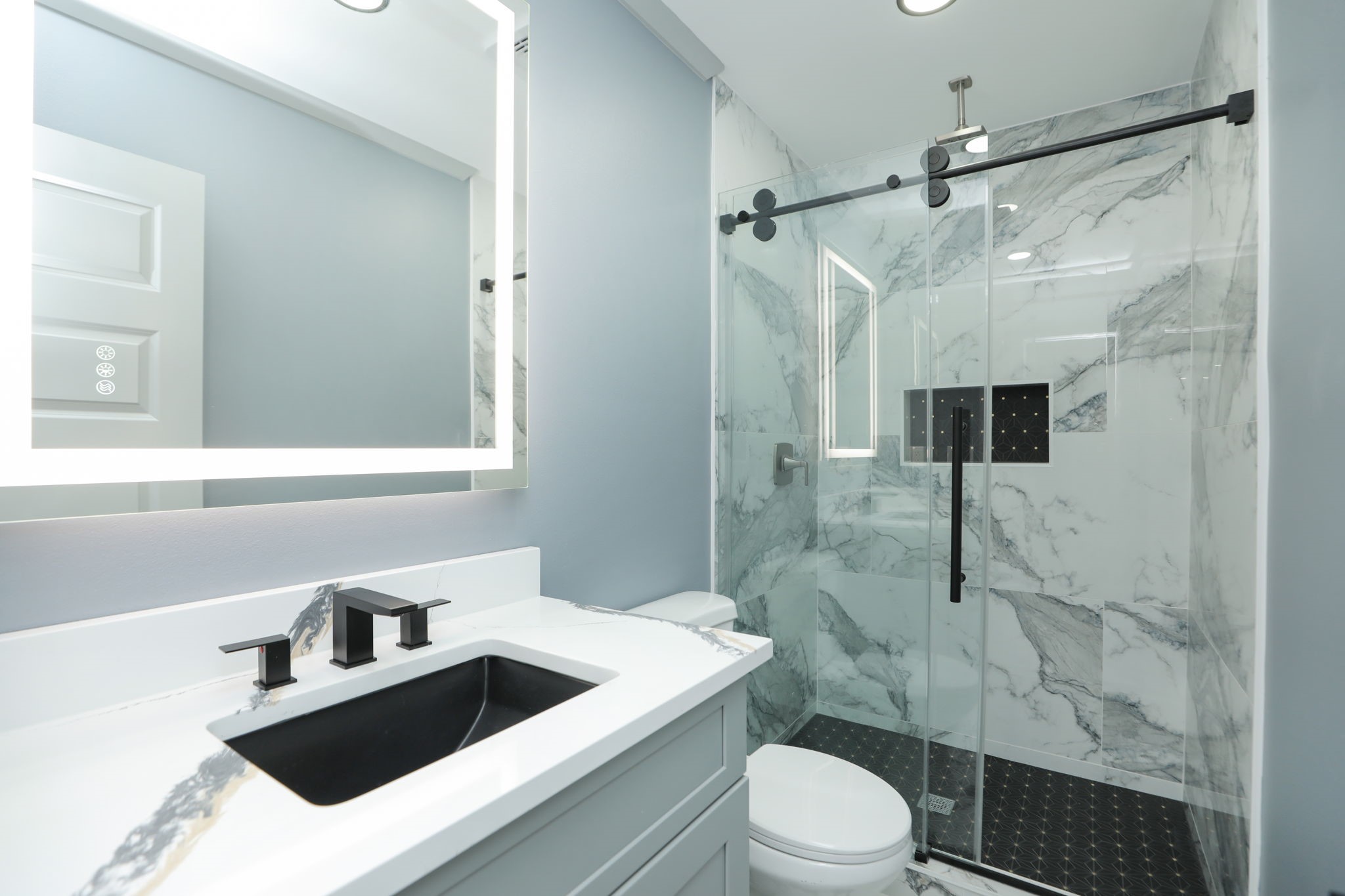 4047 Juliet Street Houston, TX 77087 - Photo 34 of 38 a bathroom with a sink toilet vanity and shower
