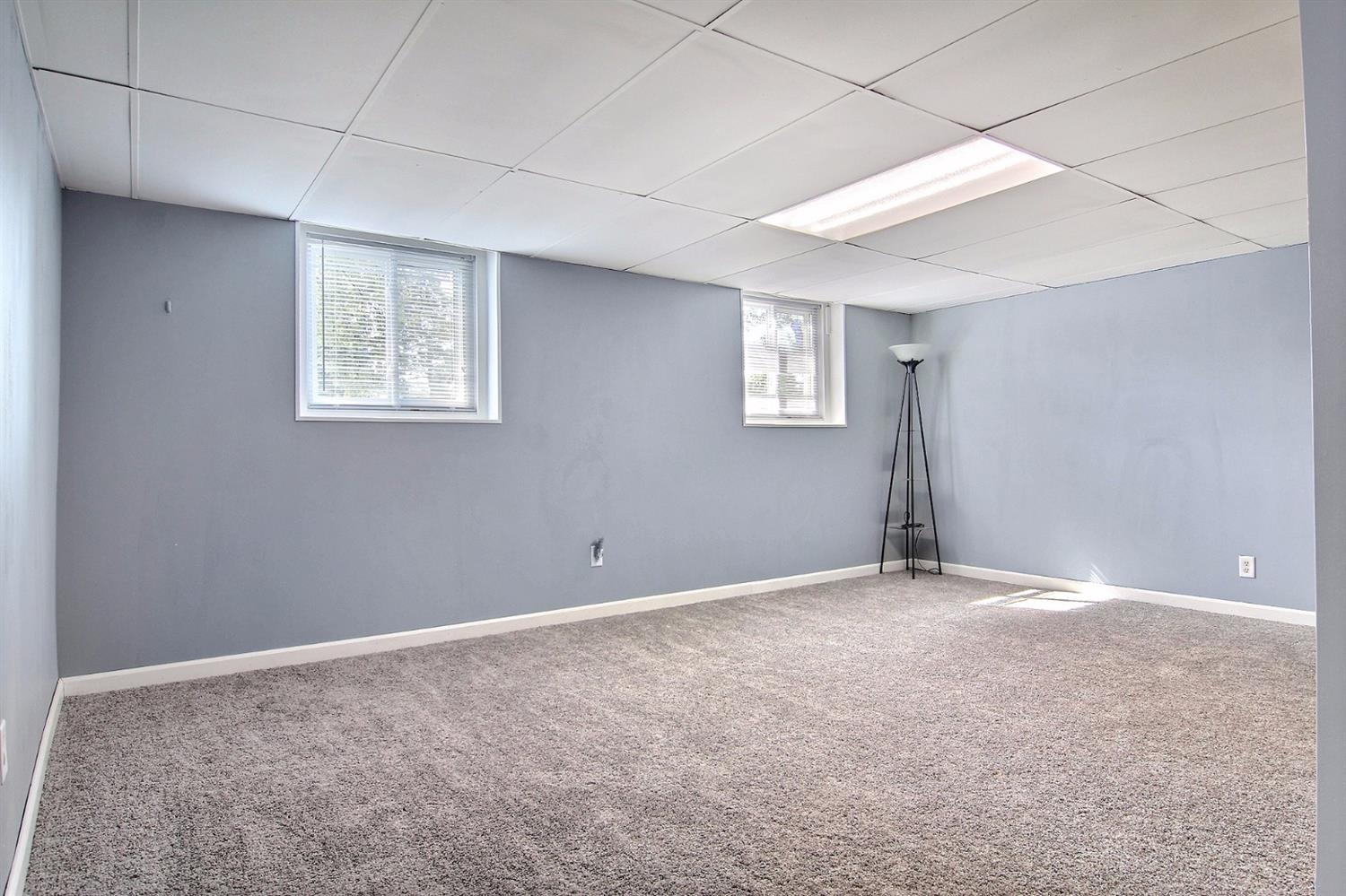 7829 Whitcomb Street Merrillville, IN 46410 - Photo 7 of 10 an empty room with windows