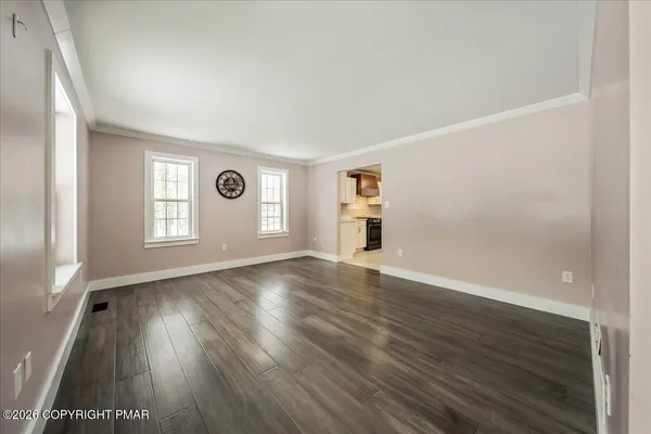 a view of an empty room and window
