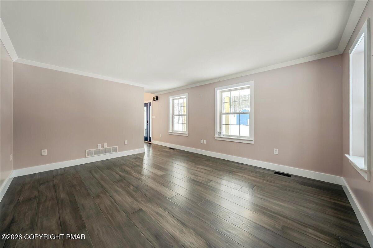 140 Alcott Lane Effort, PA 18330 - Photo 12 of 76 a view of an empty room with wooden floor and window