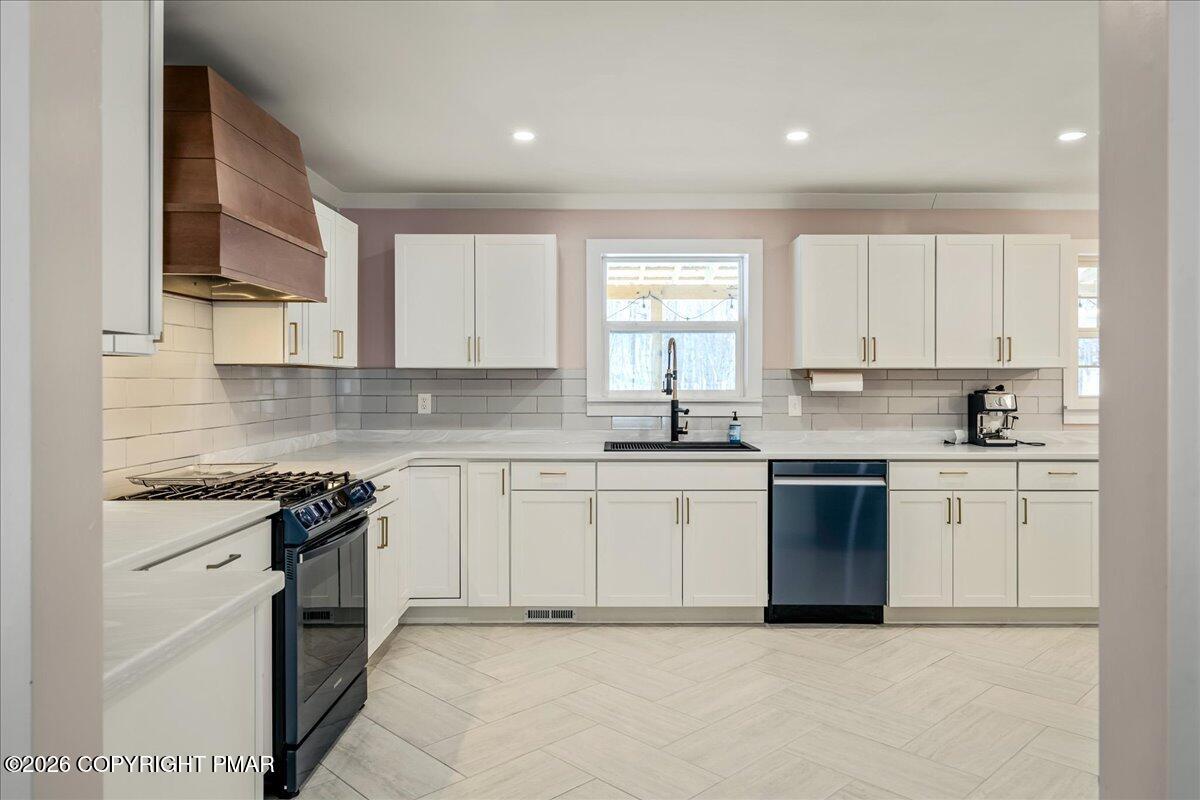 140 Alcott Lane Effort, PA 18330 - Photo 14 of 76 a kitchen with granite countertop white cabinets sink and stainless steel appliances