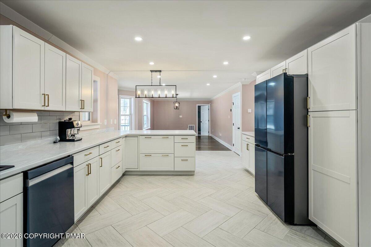 140 Alcott Lane Effort, PA 18330 - Photo 16 of 82 a large kitchen with stainless steel appliances a refrigerator and a sink