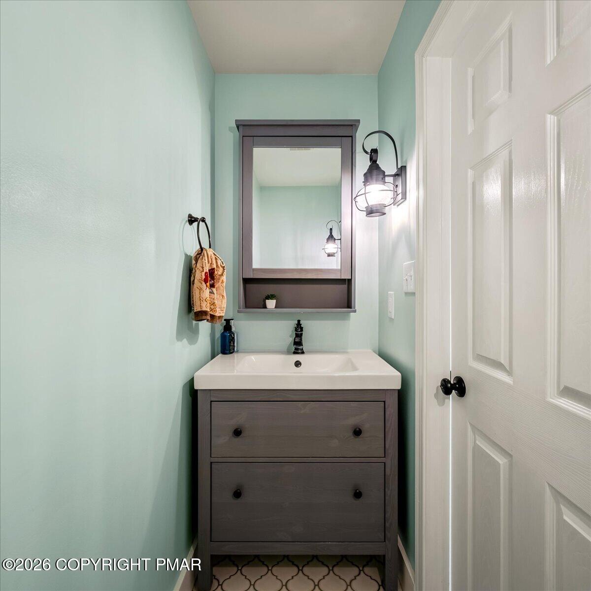 140 Alcott Lane Effort, PA 18330 - Photo 26 of 82 a bathroom with a sink and a mirror