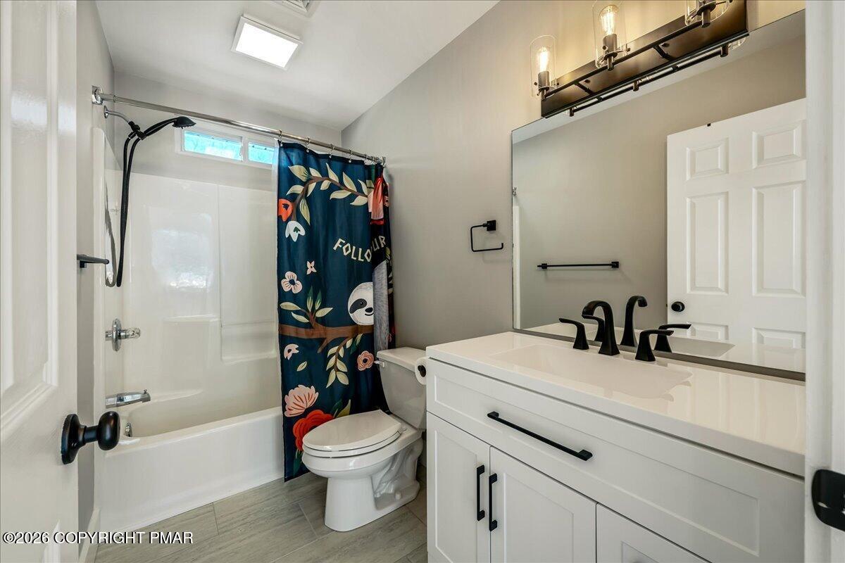 140 Alcott Lane Effort, PA 18330 - Photo 33 of 76 a bathroom with a sink toilet and shower