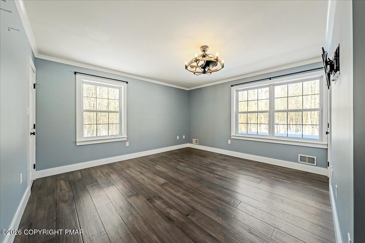 140 Alcott Lane Effort, PA 18330 - Photo 36 of 76 a view of an empty room with a window and wooden floor