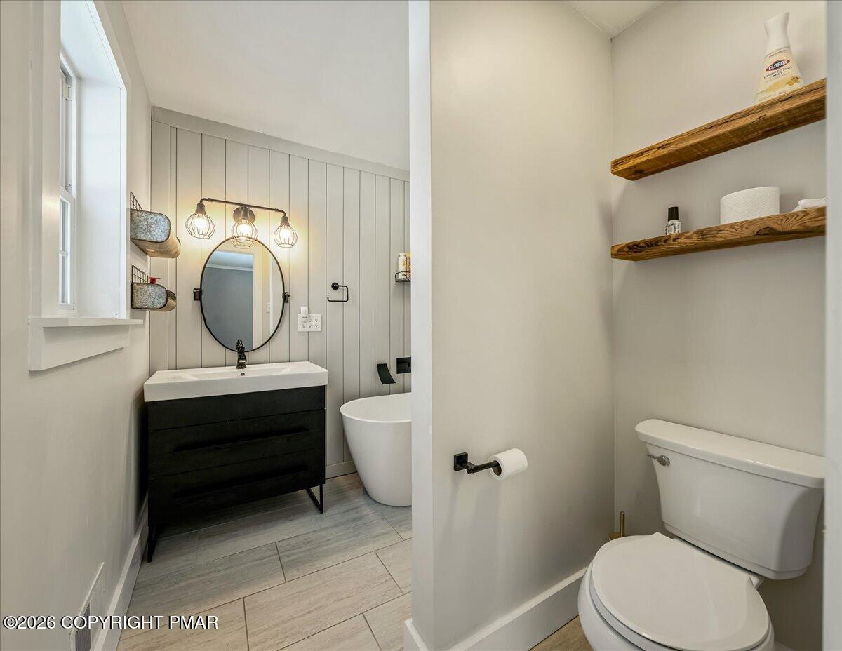 140 Alcott Lane Effort, PA 18330 - Photo 39 of 76 a bathroom with a toilet a sink and a mirror