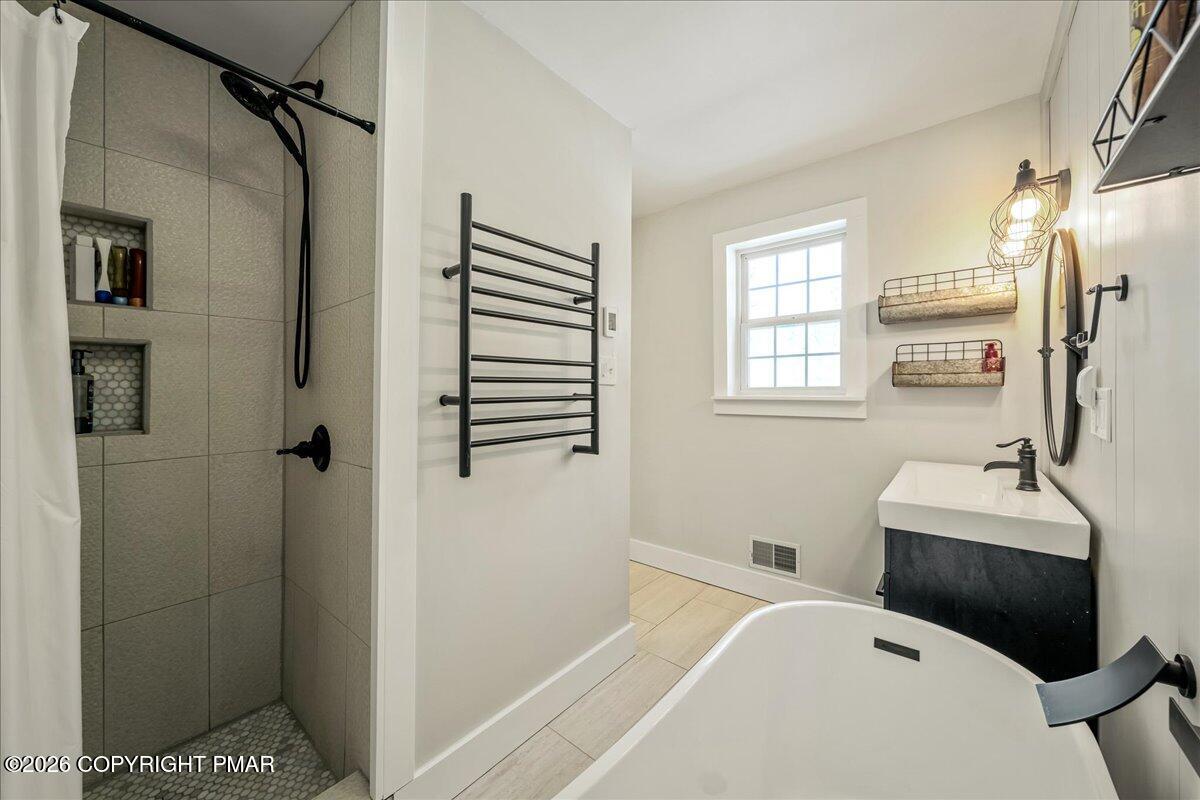 140 Alcott Lane Effort, PA 18330 - Photo 41 of 76 a bedroom with a bed and a window