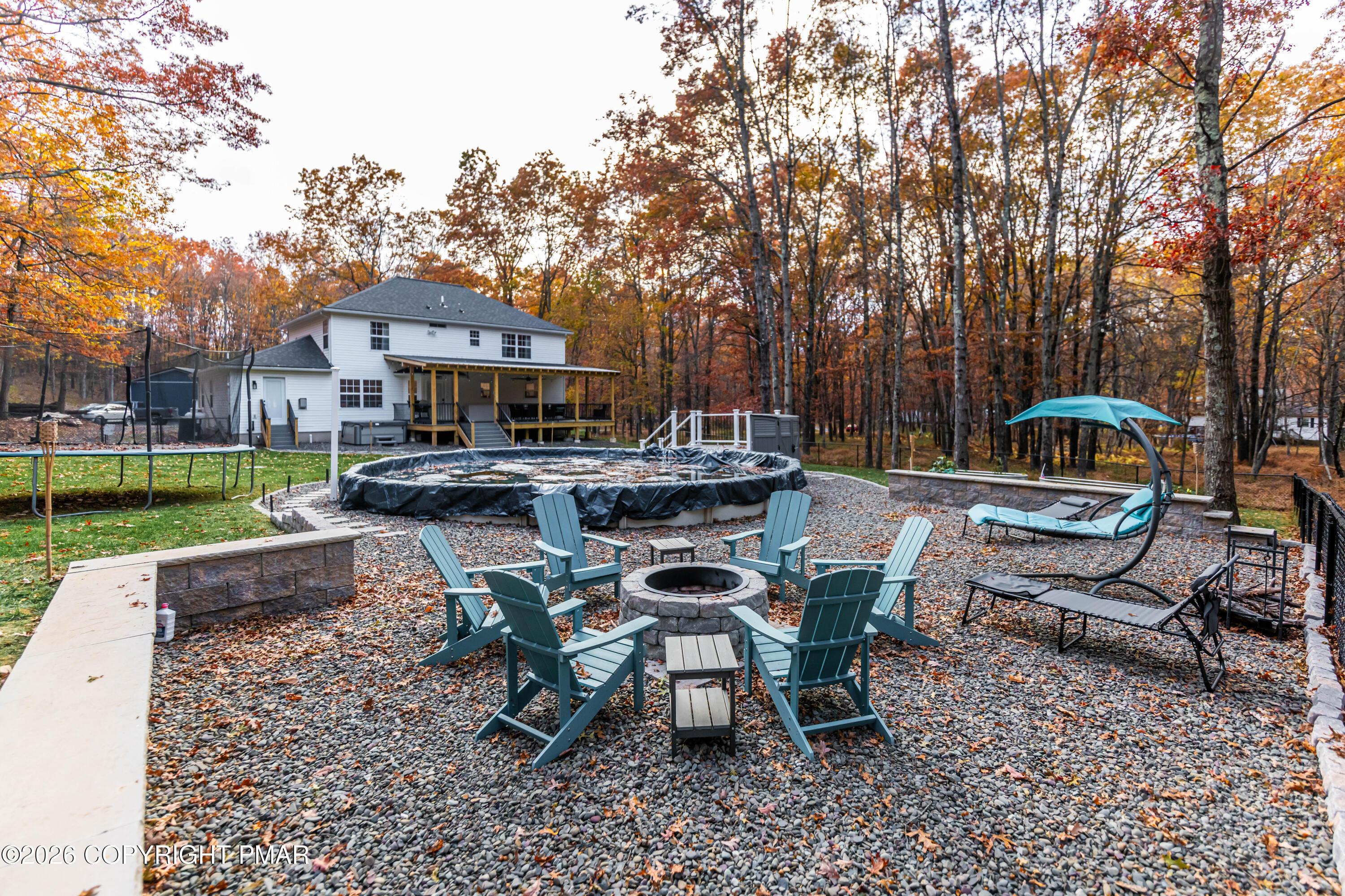 140 Alcott Lane Effort, PA 18330 - Photo 68 of 76 a view of a patio with table and chairs under an umbrella