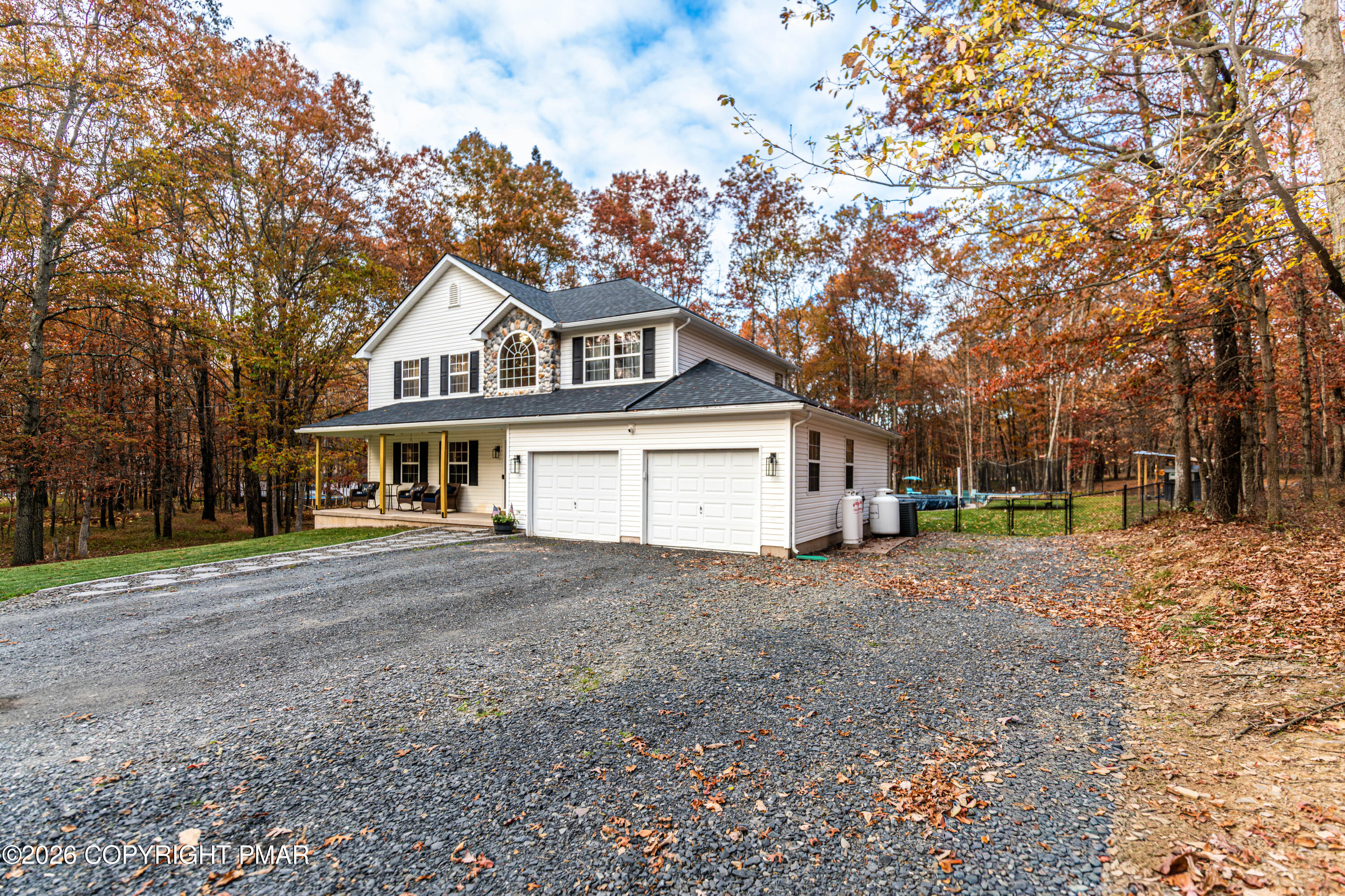 140 Alcott Lane Effort, PA 18330 - Photo 70 of 82 a front view of a house with a yard and garage