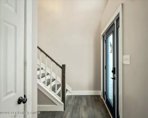 a large kitchen with stainless steel appliances a refrigerator and a sink