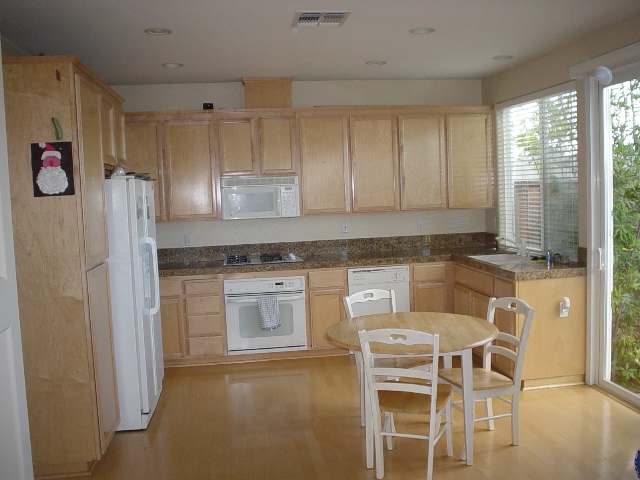 36 Terraced Hills Circle San Ramon, CA 94583 - Photo 3 of 4 a kitchen with stainless steel appliances granite countertop a stove and a refrigerator