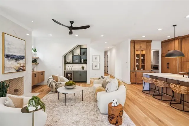 a kitchen with a sink a stove and cabinets